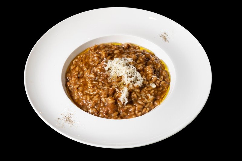 Arroz cremoso del Delta de l’Ebre con butifarra, berenjena ahumada y queso del Alt Urgell y la Cerdanya