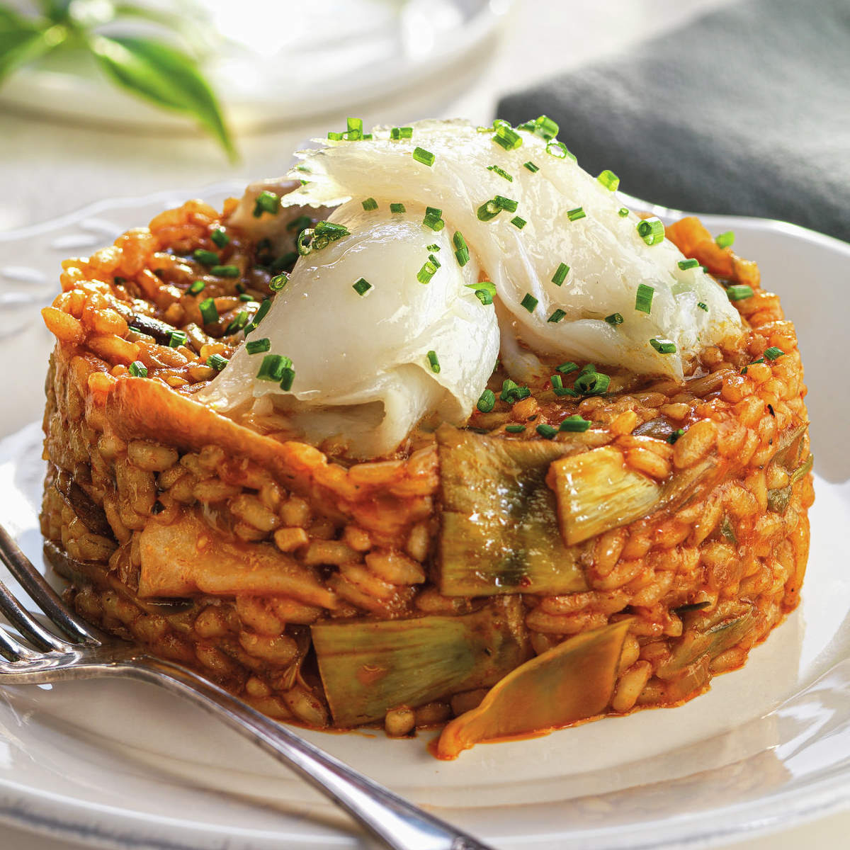 Timbal de arroz meloso con setas y bacalao