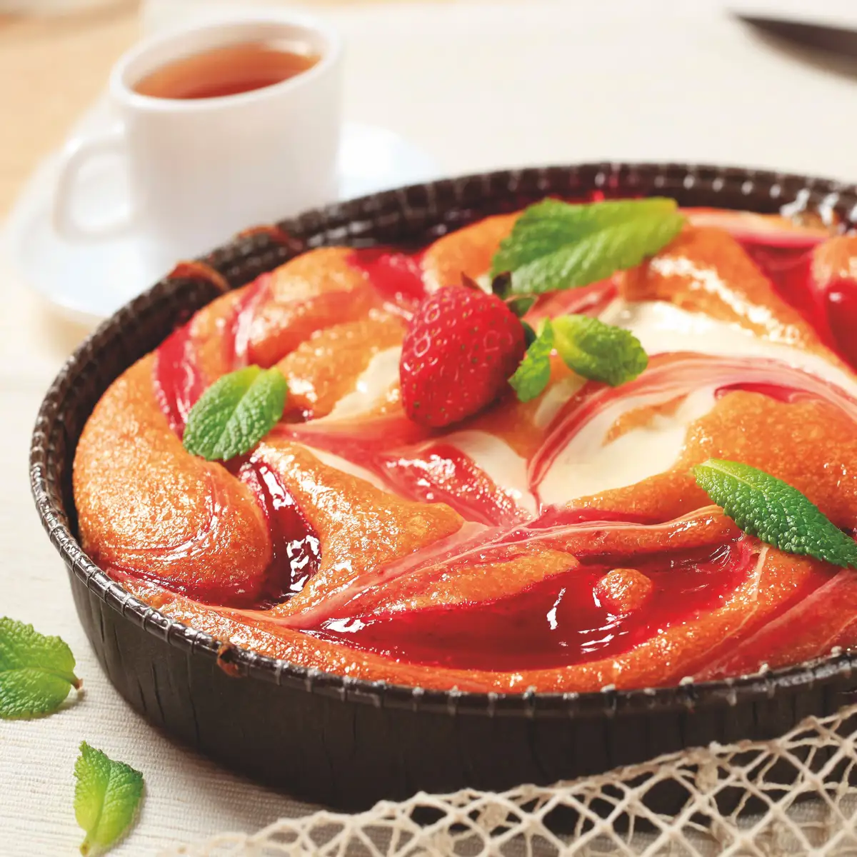 Pastel de queso y coulis de fresón